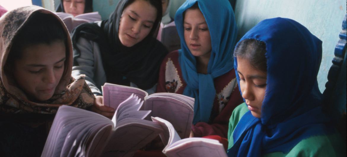 Girls read from their textbooks at the Dasht-e-Barchi Education Centre in Kabul, Afghanistan. (file)